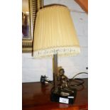 Table lamp with bronze putti on a marble base