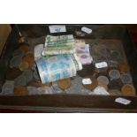 Tin of old coins and banknotes