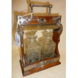 Victorian Dresser style two decanter oak tantalus with silver plated details and marked as PATENT.