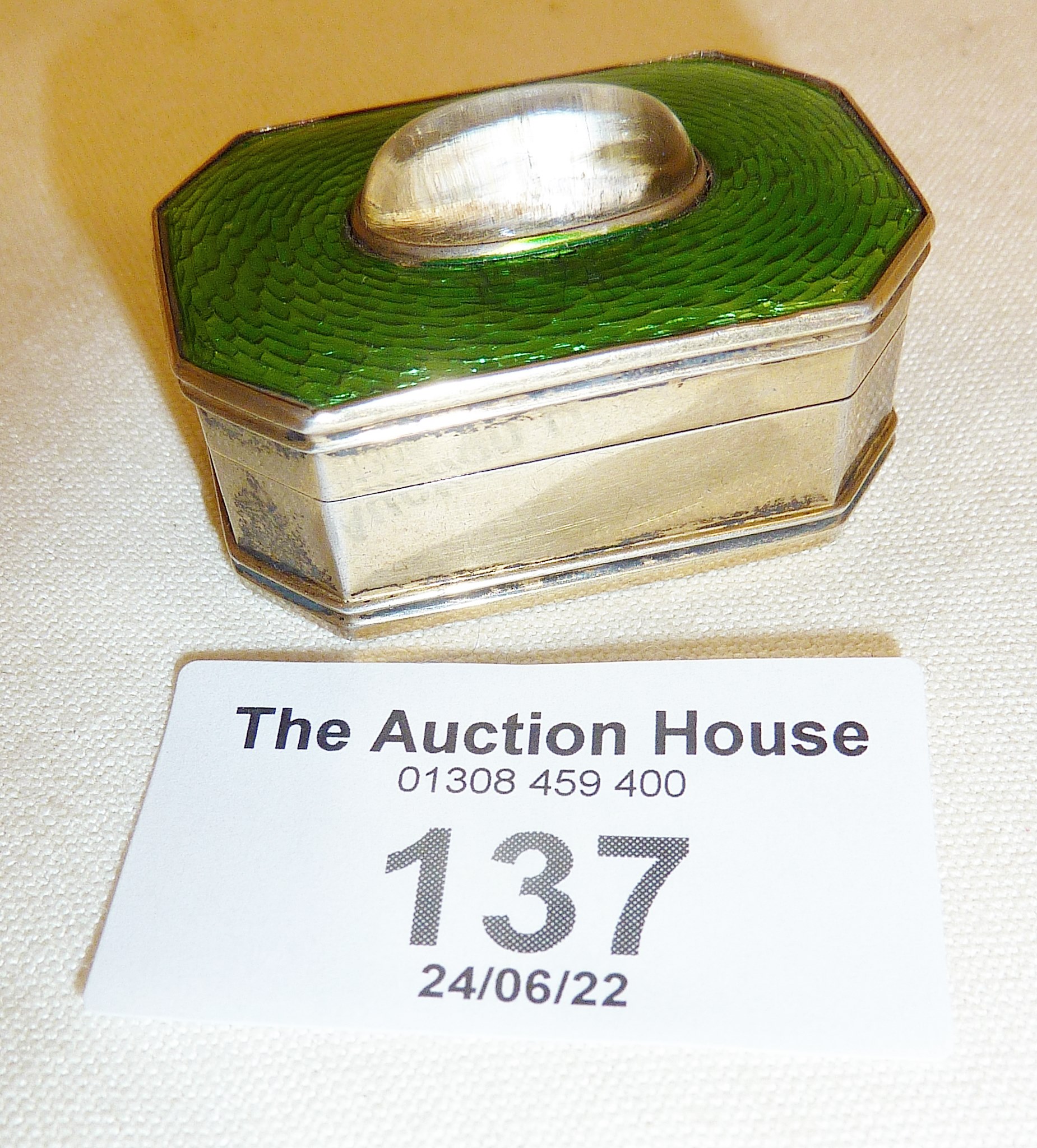 Silver gilt and rock crystal box with green guilloche enamel lid (some cracking to enamel)