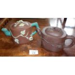 Two Chinese Yixing redware teapots, one with monkeys decoration