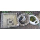 Two stonework bird baths and a tub