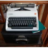 Olympia SM typewriter with case and booklet