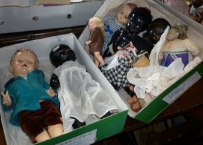 Nine various dolls, inc. three black composite and plastic dolls