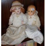 A J.D. Kestner all bisque doll with fixed glass eyes and open mouth, 16" tall, mould no. 617, and