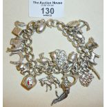 Heavy silver bracelet with many charms - marked as Sterling, weight approx. 81g