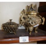 Chinese bronze two-handled censer with relief dragons figural decoration on tripod legs with