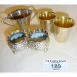 Pair of Russian silver gilt engraved vodka shot cups, hallmarked silver pair of salts and a