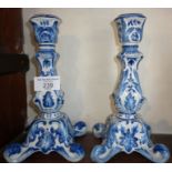 Pair of blue and white faience pottery candlesticks, marked Mosanic, 8" high