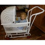 1930's child's painted wicker (Lloyd Loom style) doll's pram with hinged hood and inc. a Gotz