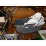 Vintage tinplate toy doll's pram with doll