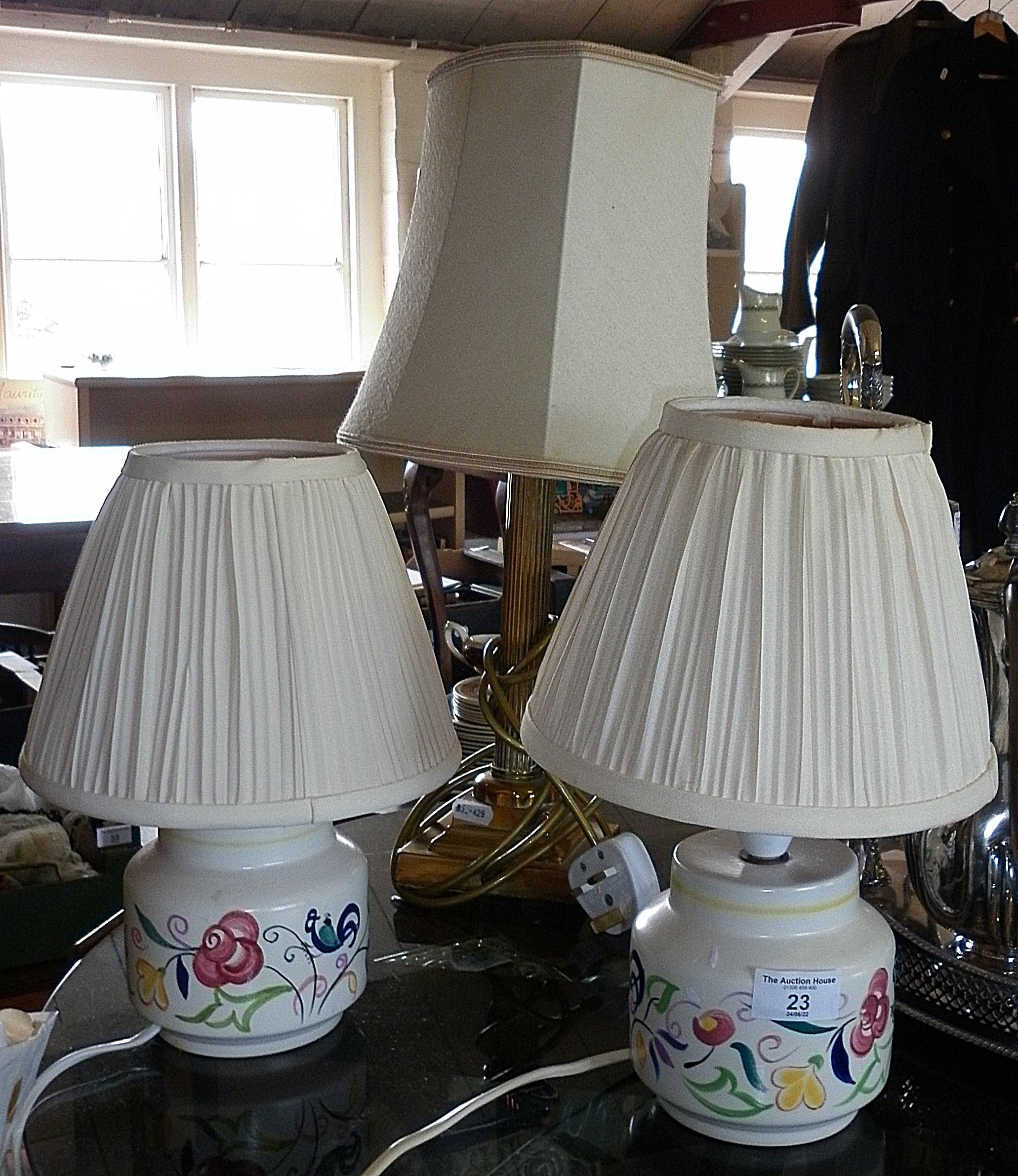 Pair of Poole Pottery table lamps and a brass Corinthian column table lamp