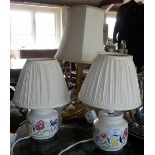 Pair of Poole Pottery table lamps and a brass Corinthian column table lamp