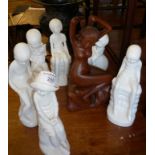 Six Spode Pauline Shore white glazed figures and a carved hardwood figure of a naked lady doing
