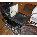 Triang coach built dolls pram with hood and cover, c. 1950's and an "OK" Kader plastic baby doll