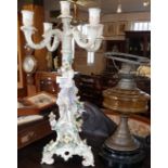 Continental porcelain five-branch candle stick centrepiece and an oil lamp