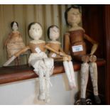 Four Folk Art painted wood jointed peg dolls