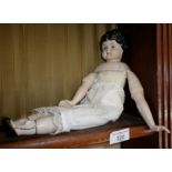 Victorian china head doll with shoulder, arms and legs with moulded footwear, having moulded wavy
