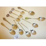 Assorted hallmarked silver (and some enamel) golfing and souvenir spoons. Combined weight approx.