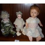 Three various dolls inc. "Playtime in Fall" bisque headed doll