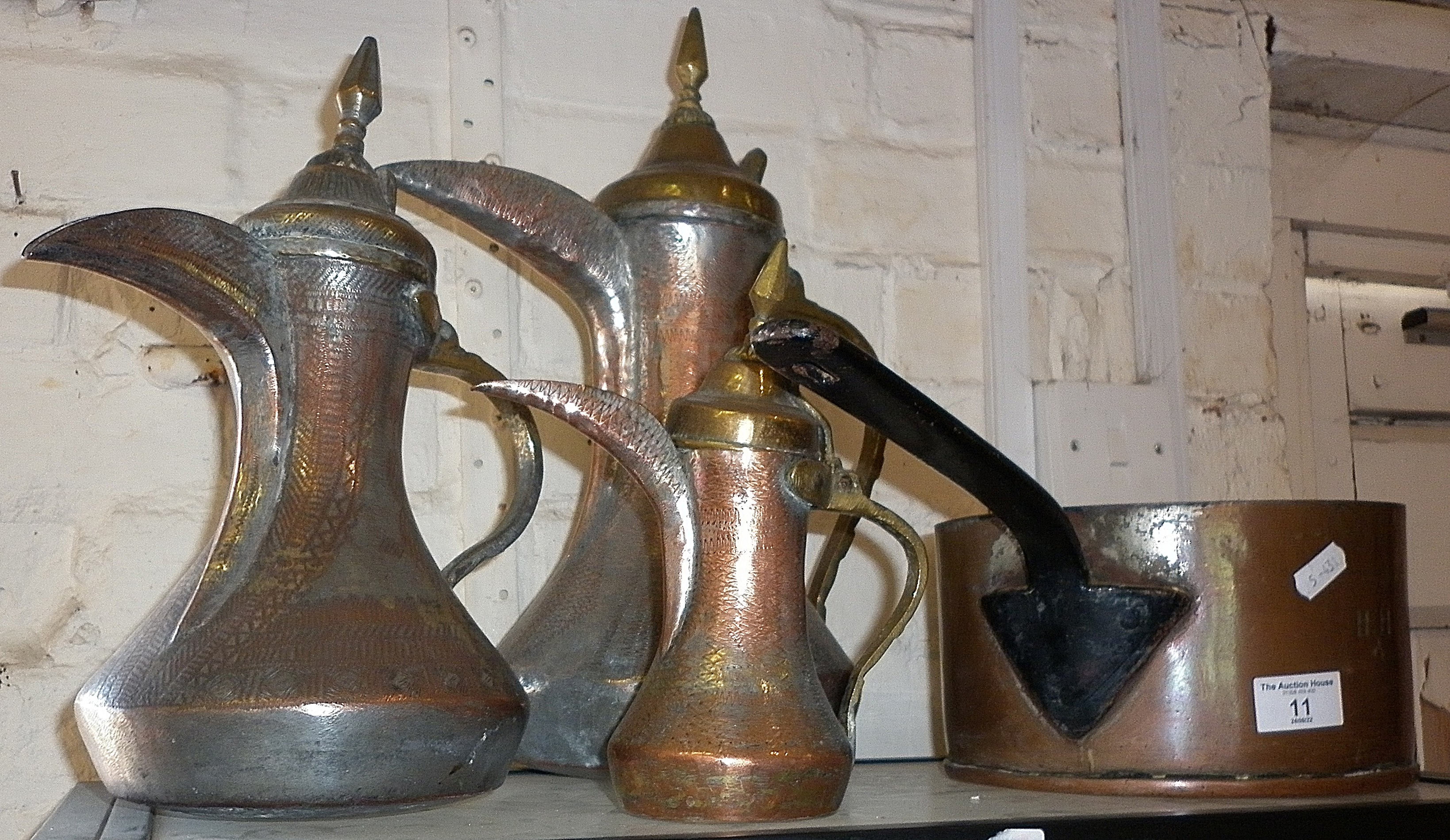 Victorian copper saucepan and three various Turkish silvered copper and brass coffee pots