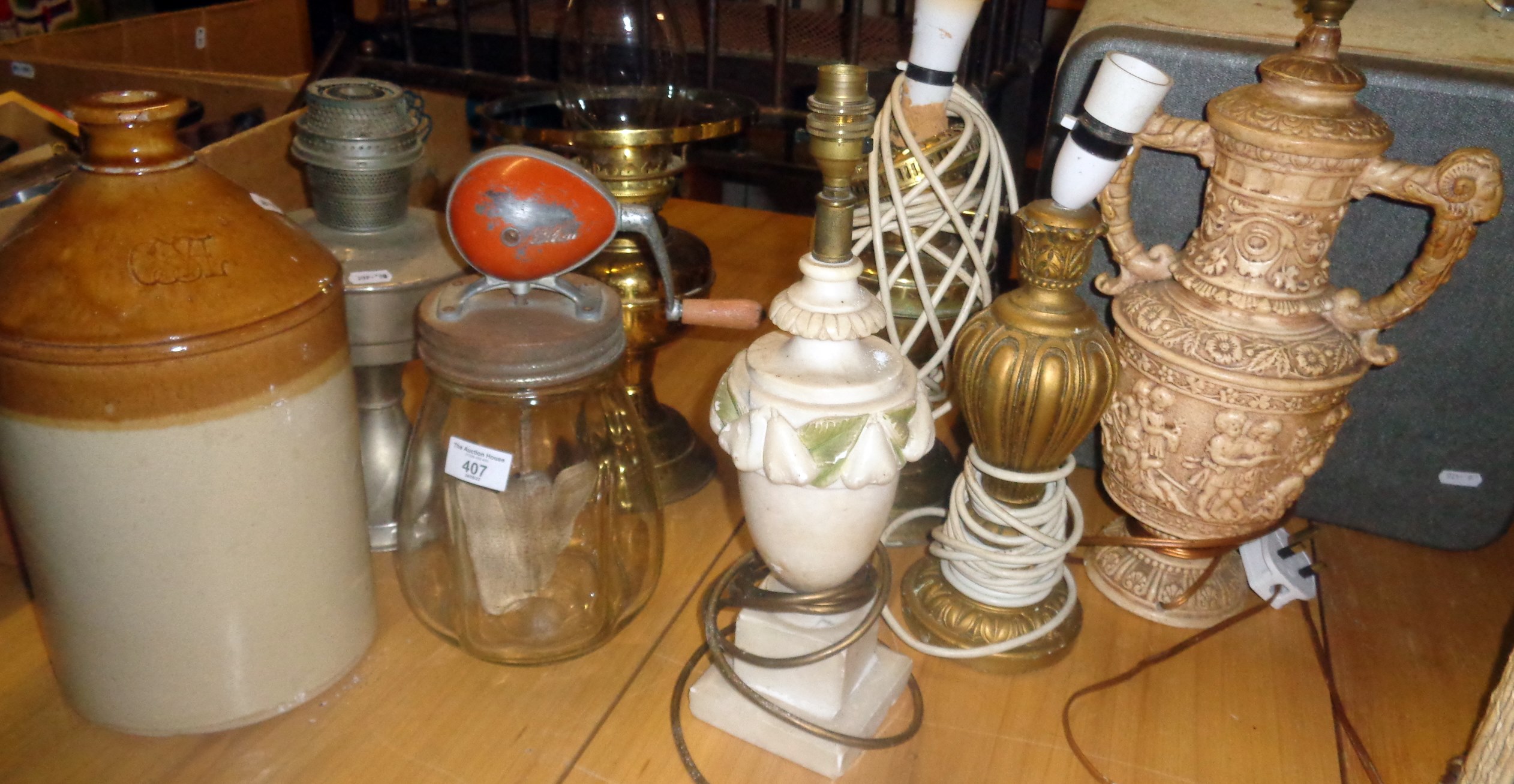 A vintage 'Blow' glass butter churn and six various table lamps and a one gallon stoneware flagon