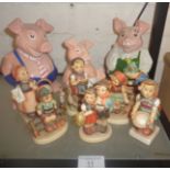 Seven assorted Hummel figures and three Wade Nat West pigs