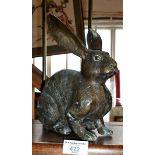 A bronze figure of a seated hare