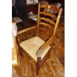 Set of 7 ladderback dining chairs with rush seats, inc. carver