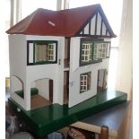 Detached wooden doll's house, unfurnished but with integral garage