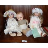 A PJM stamped bisque headed doll, a Kestner XI reproduction bisque doll and a German composition