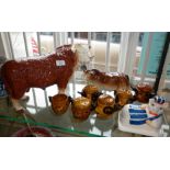 Large Melbaware Hereford Bull, together with six beef dripping pots, another bull and a 'pig in an