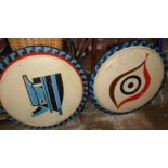 Two Native American inspired painted fibreglass shields made by John Eagle, 32" diameter