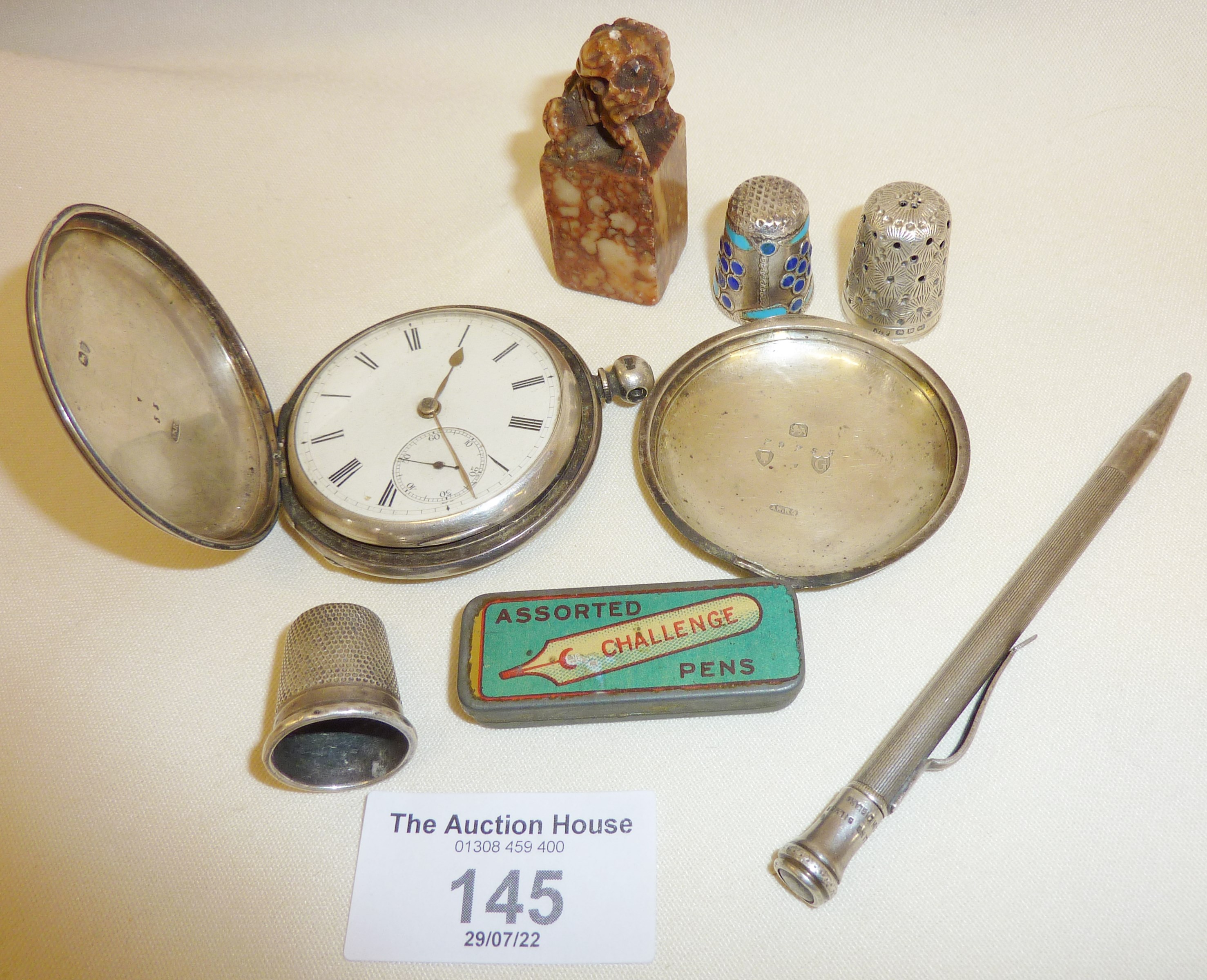 Silver pocket watch (A/F), silver thimbles, pen nib case, sterling silver pencil, and carved