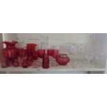 Collection of cranberry glass jugs and goblets and crystal wine glasses