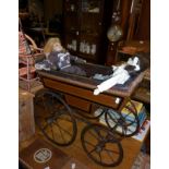 19th c. French coach built dolls pram having painted wood body on metal springs and four wheels, and