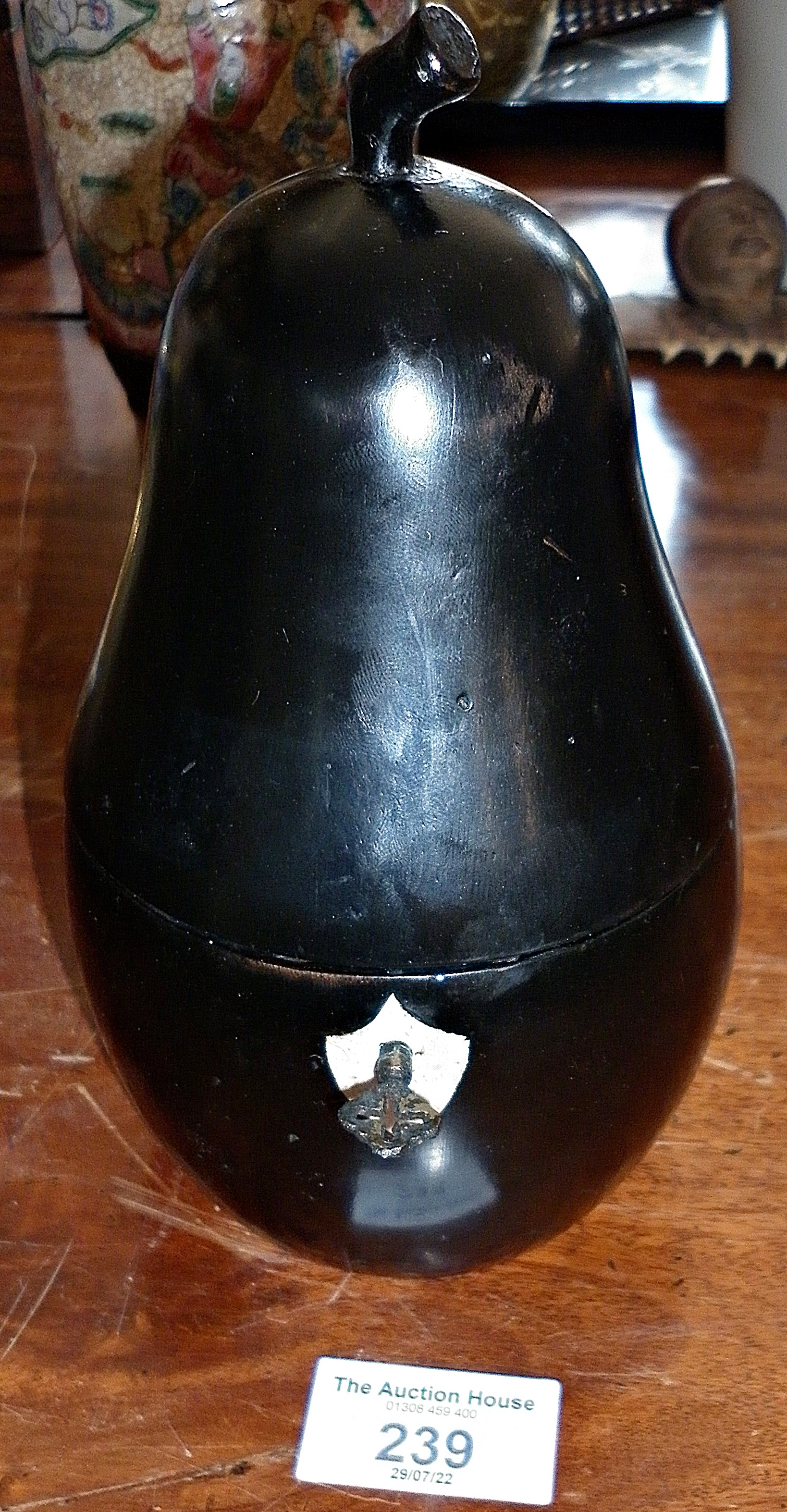 Ebonised wood pear-shaped tea caddy with key, lined, 7" high