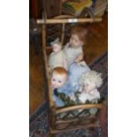 Canework dolls crib and four various dolls