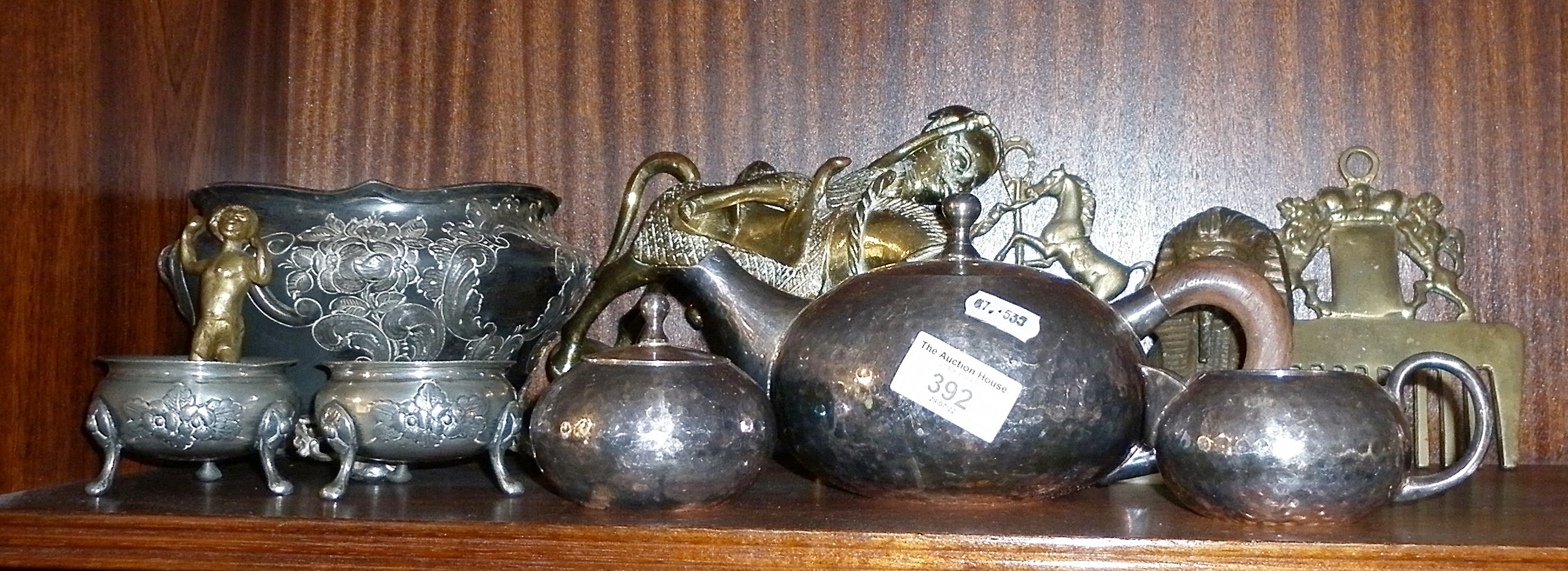 Arts & Crafts beaten pewter teaset, Benin brass horse and rider, two brass crested curry combs etc