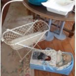 Victorian folding metal dolls cot and a later dolls carry cot with three dolls