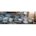 Large quantity of Chinese porcelain blue and white rice pattern bowls and cups, most with four