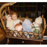 Canework dolls crib and four various dolls