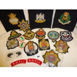 Collection of military cloth and bullion badges