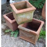 Three terracotta planters