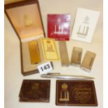 Gold plated Dunhill Rollagas lighter in case, two other Dunhill mini Rollalite lighters, a