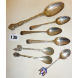 Heavy and ornate Victorian silver berry spoon decorated with grape vines and bunches of grapes,