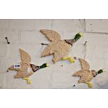 Three ceramic wall hanging flying ducks