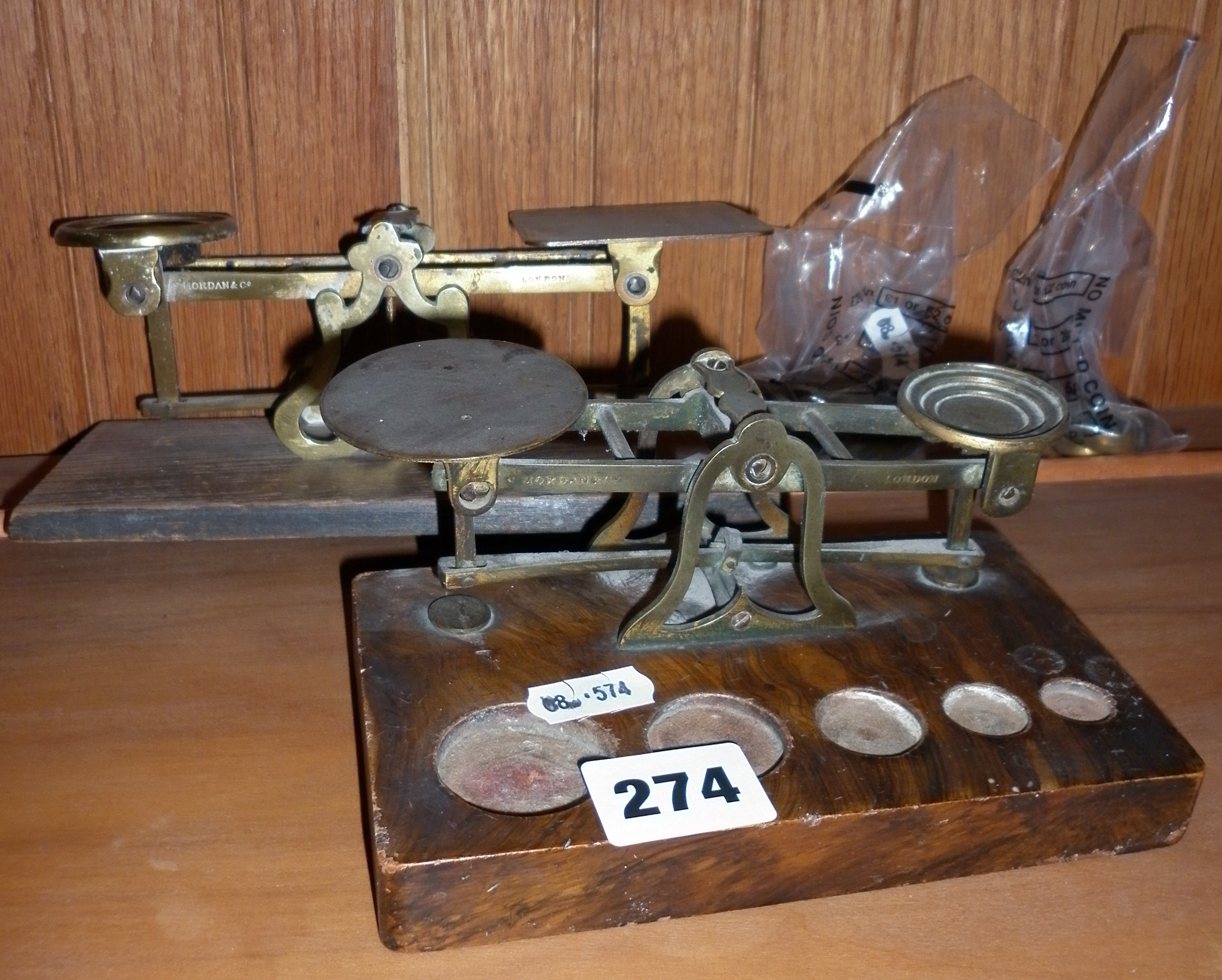 Two Victorian brass postal scales with weights