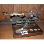 Two Victorian brass postal scales with weights
