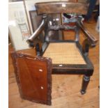 19th c. Colonial made elbow chair with cane seat and a carved hardwood tray